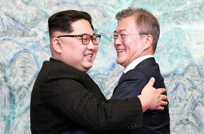 Kim Jong Un and Moon Jae-in embrace after signing the Panmunjom Declaration for Peace