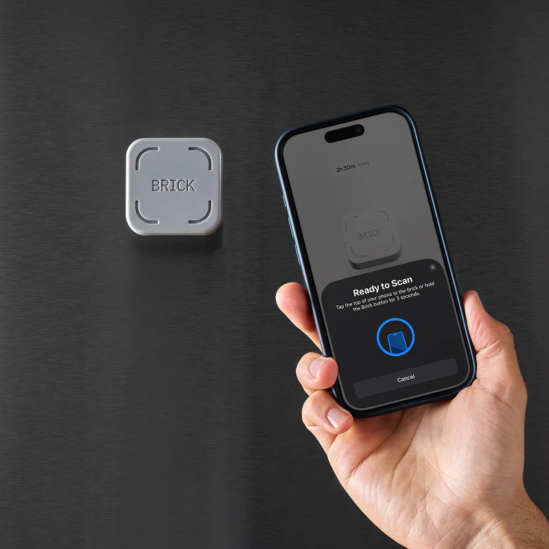 A person uses the Brick app-blocking device