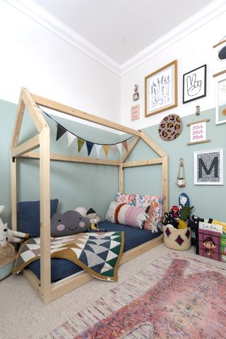 kid's bedroom with fun house-shaped bed