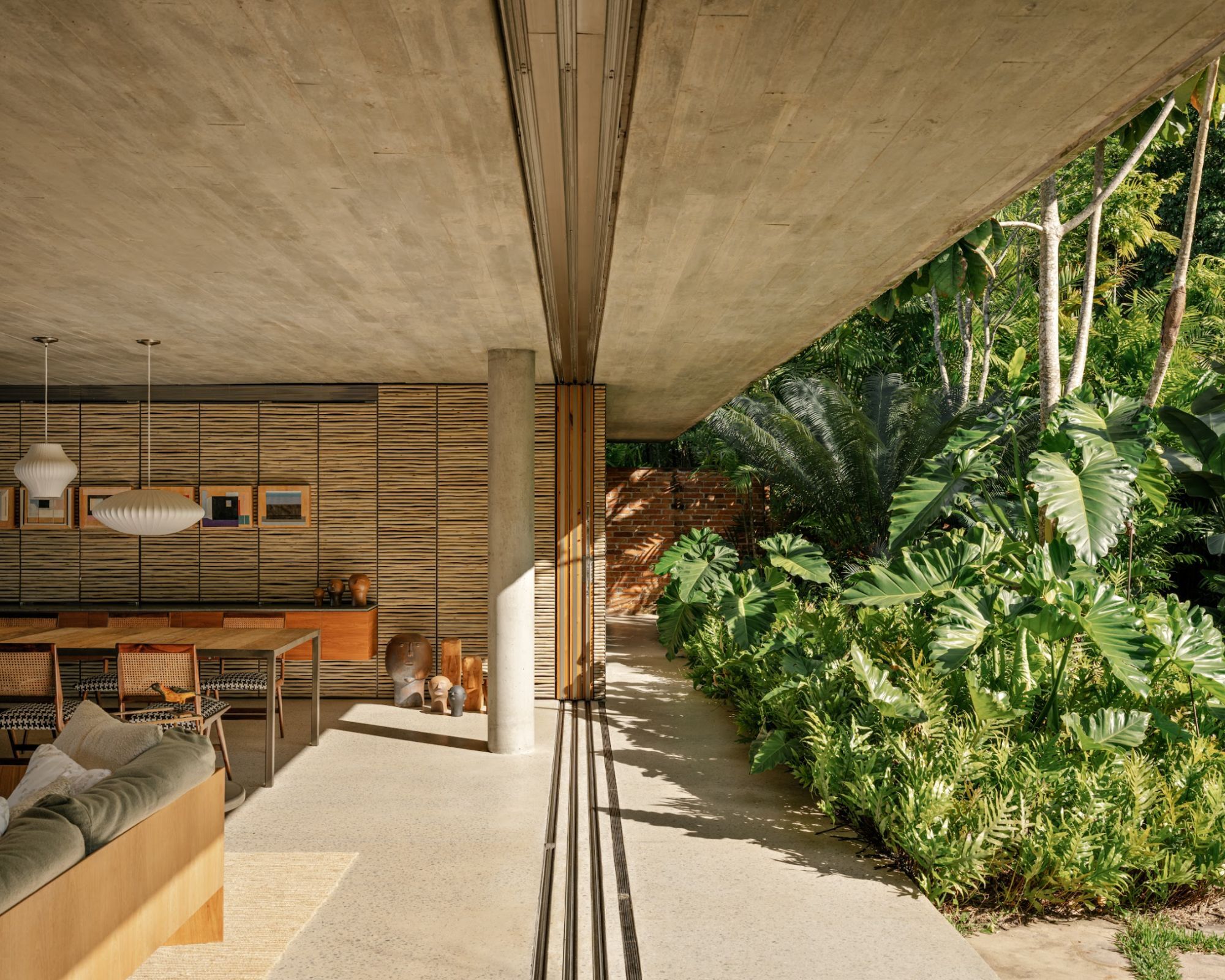 Sitting room opening up to tropical garden
