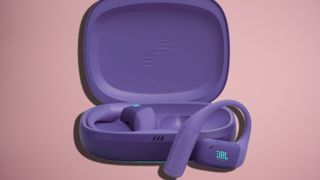 JBL Endurance Zone earbuds in purple, on TR's pink background