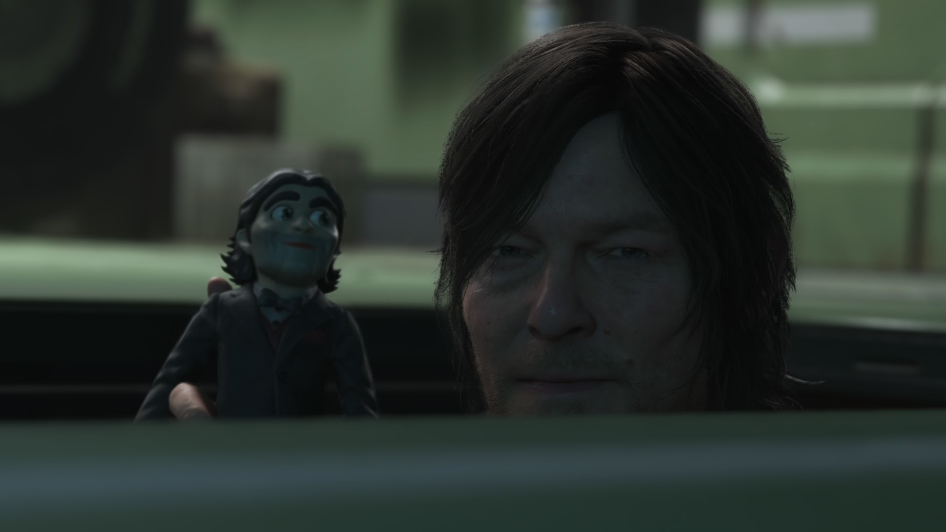Dollman and Sam peek through a hatch in Death Stranding 2: On the Beach