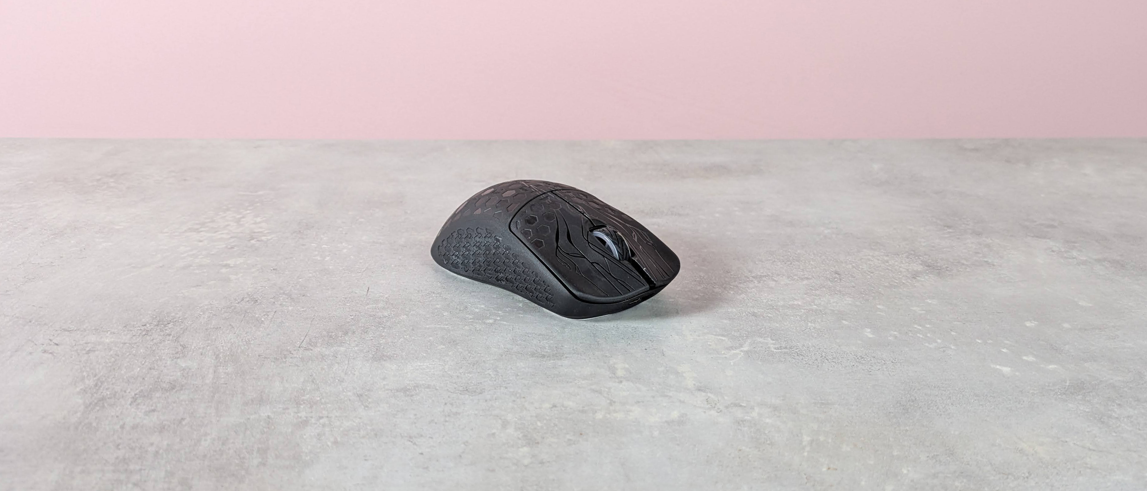 Three-quarter view of Keychron G5 on a desk with pink wall in background