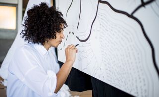 Artist Shantell Martin working on an art piece for Max Mara.