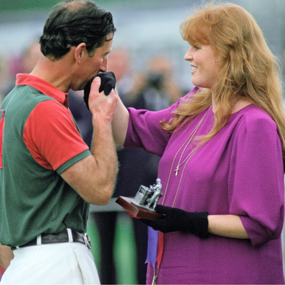 Prince Charles Kisses The Duchess Of York's Hand As She Presents Him With A Prize After A Polo Match At Windsor In Berkshire