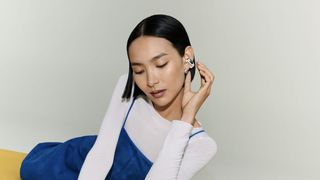 Bose Ultra Open Earbuds (2nd Gen) on woman sitting on floor
