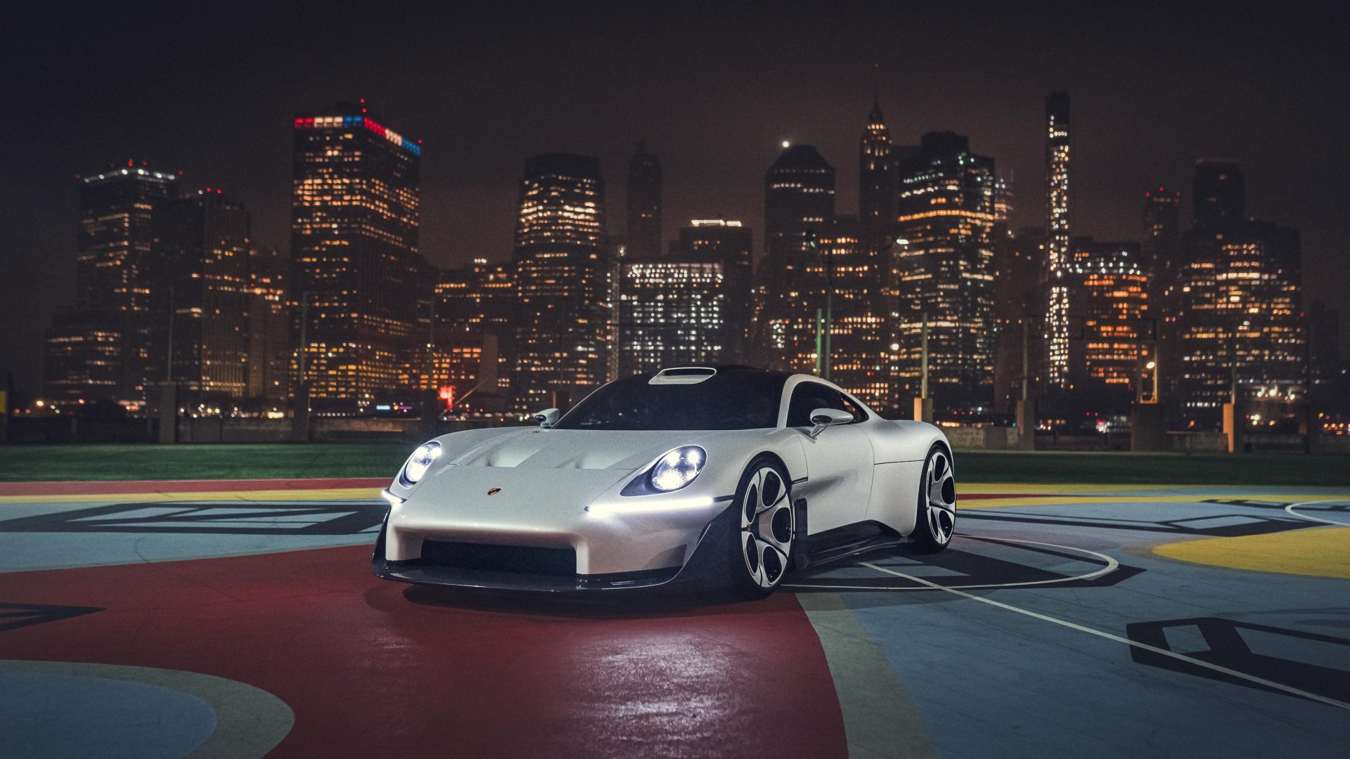 The Mission S on a pier at night, with New York's skyline behind