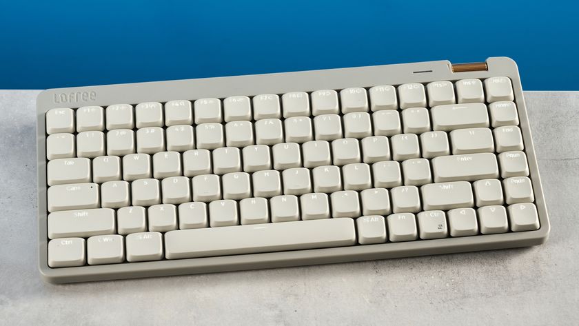 The Lofree Flow Lite84 on a stone surface against a blue background