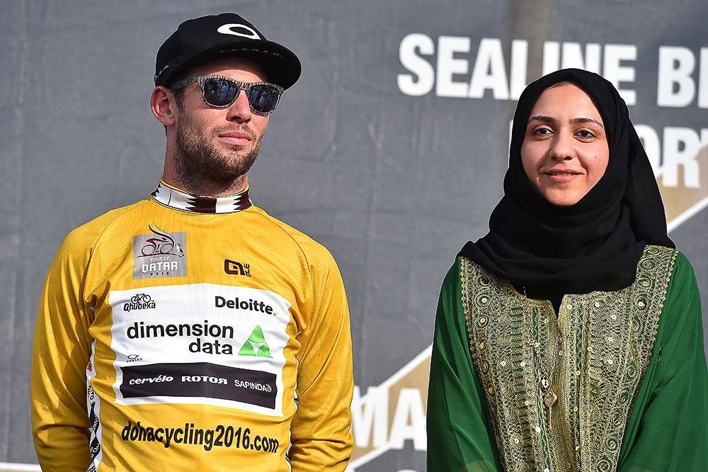 Mark Cavendish on the stage 1 podium in Qatar