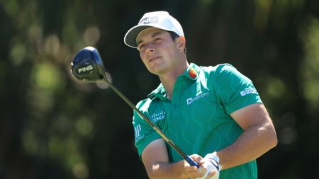 Viktor Hovland plays his tee shot at the seventh hole at TPC Sawgrass