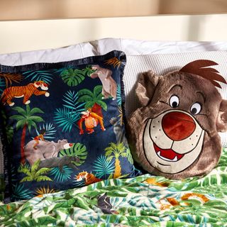 kids room with animal print pillow and bed