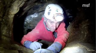 scientists descending into northern spain cave called pit of bones.