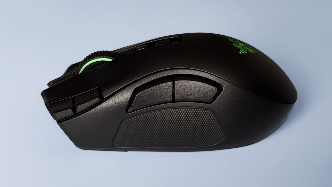 The Razer Naga V3 Pro mouse against a blue background.