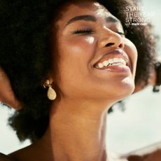 Mouth gut axis: A woman smiling showing her teeth