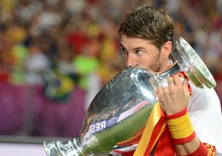 Sergio Ramos kisses the European Championship trophy after Spain's win at Euro 2012.
