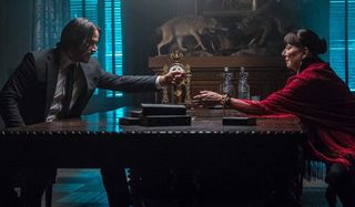John Wick: Chapter 3 - Parabellum John offers his token to The Director in the study