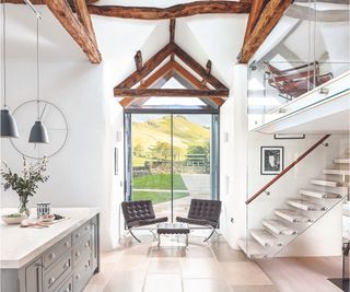 Wooden beams, black leather chairs