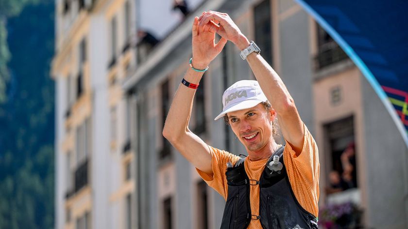 Jim Walmsley with arms raised at the finish line of the UTMB in 2023