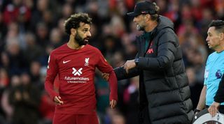 Manager Jurgen Klopp talks with Mo Salah of Liverpool during the Premier League match between Liverpool and Manchester City at Anfield on October 16, 2022 in Liverpool, England.