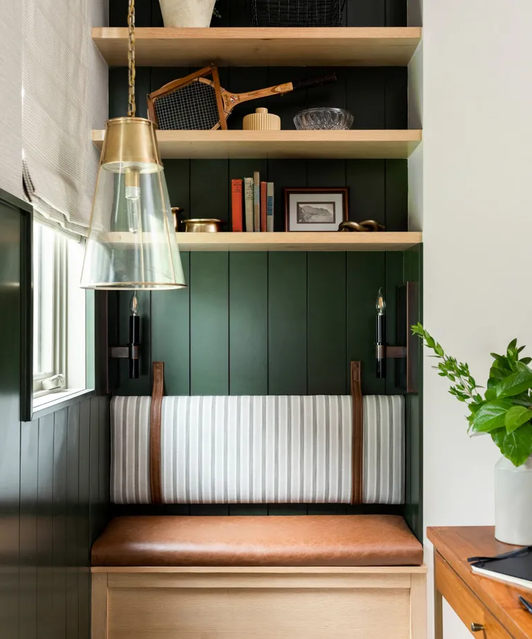 Seating nook painted in dark green