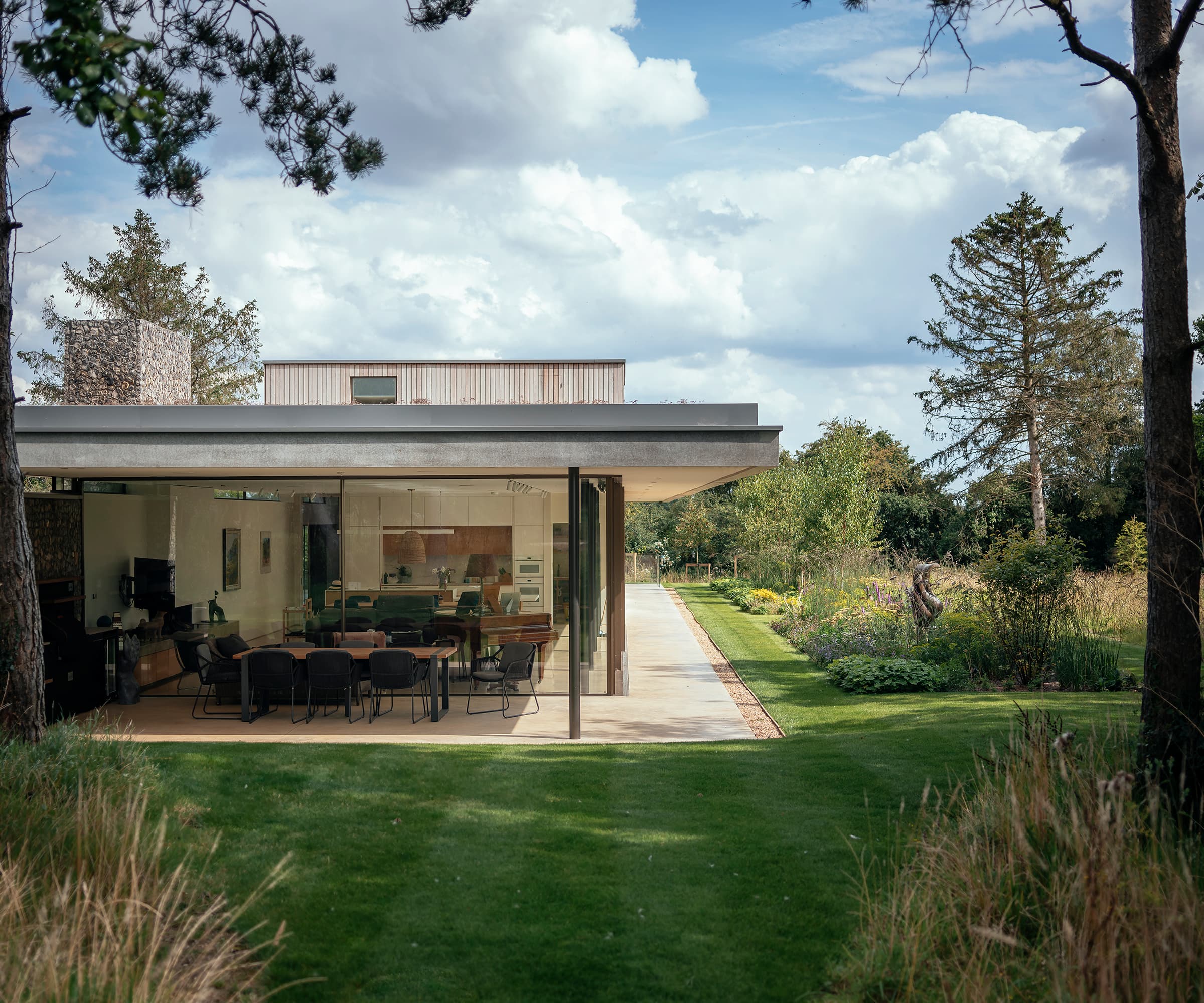 A self build with an open-plan dining room surrounded by nature