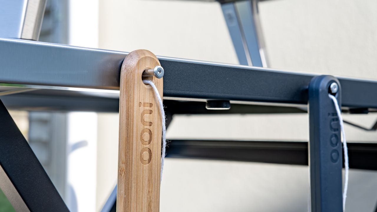 Ooni Karu 2 pizza oven table with accessories hanging from it