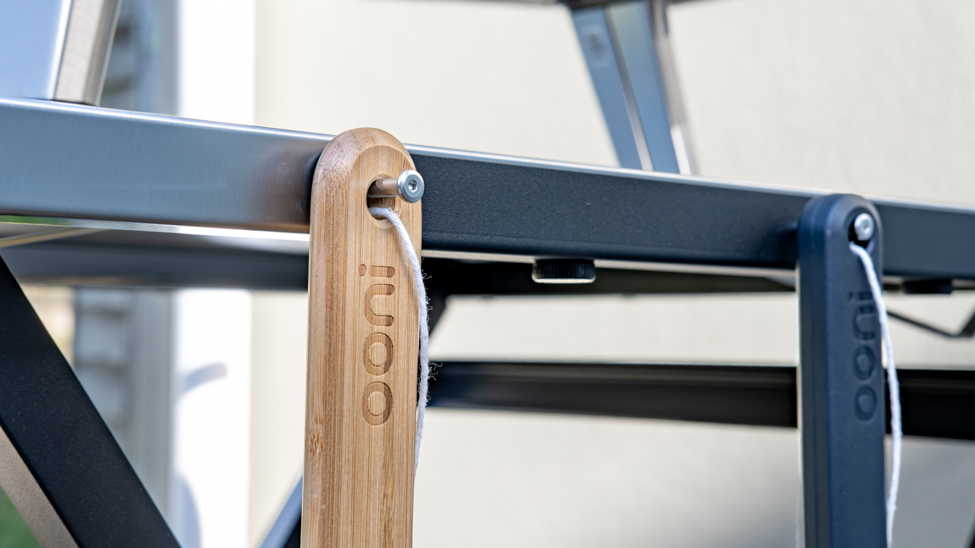 Ooni Karu 2 pizza oven table with accessories hanging from it