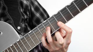 guitarist playing chord