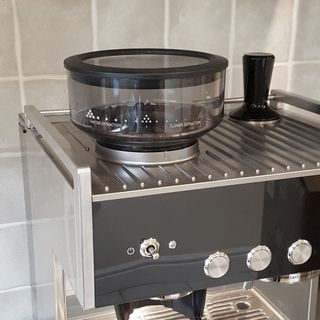 The hopper and tamper of the Breville Barista Signature Espresso Machine