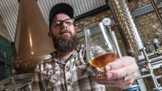 In Flames’ Anders Fridén holds up a glass of whisky