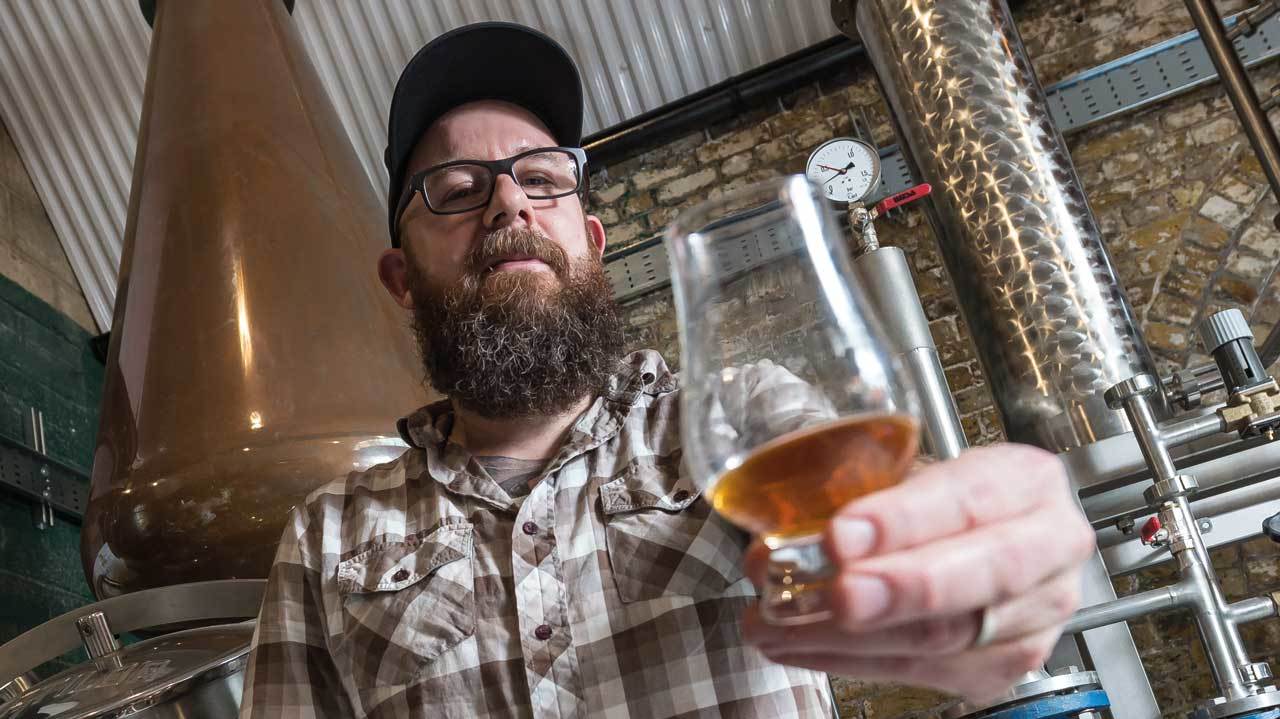 In Flames’ Anders Fridén holds up a glass of whisky