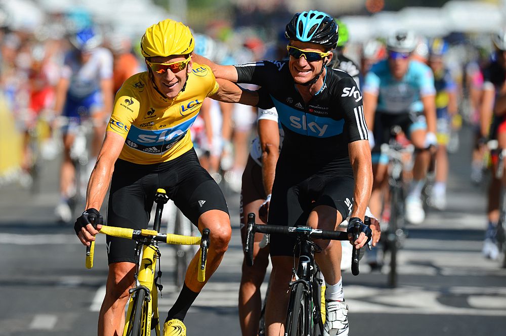 Michael Rogers cebebrates with teammate Bradley Wiggins at the 2012 Tour de France
