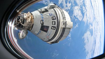 Boeing’s Starliner spacecraft is pictured docked to the Harmony module’s forward port at the International Space Station.