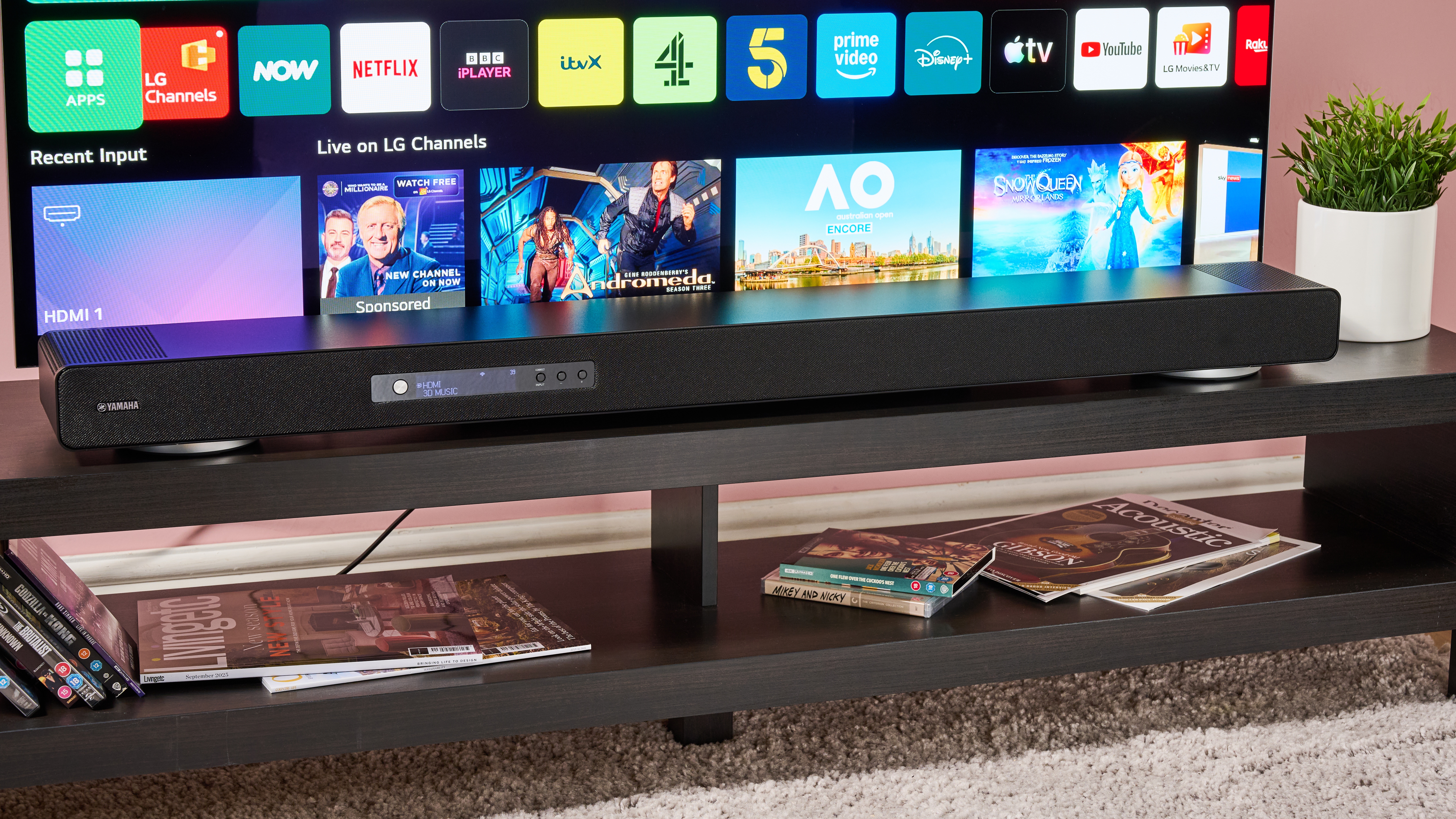 Yamaha True X Surround 90A soundbar on stand in front of LG TV