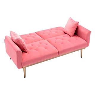 A peach-hued sofa bed opened out into a bed, with a white background.