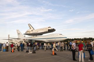 Media representatives are given the opportunity to photograph space shuttle Endeavour, secured atop NASA's Shuttle Carrier Aircraft or SCA, at the Shuttle Landing Facility at NASA's Kennedy Space Center in Florida on Sunday (Sept. 16, 2012). The SCA, a modified 747 jetliner, will fly Endeavour to Los Angeles where it will be placed on public display at the California Science Center.