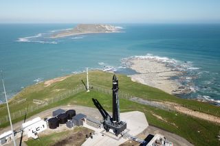 A Rocket Lab Electron booster stands poised to launch three experimental satellites for the U.S. Air Force from the company's New Zealand pad on May 4, 2019 local time. That day's attempt was called off to perform additional payload checks.