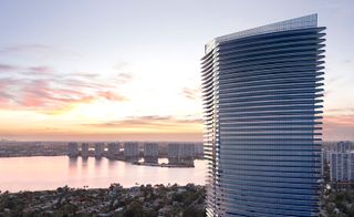 Exterior of The Residences with view of the city in the background