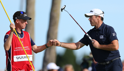 Julian Guerrier fist pumps with his caddie