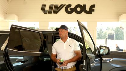 Bryson DeChambeau gets out of a car