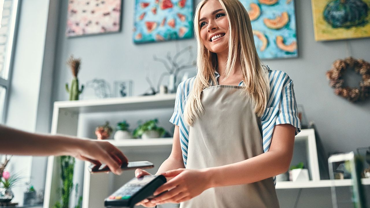 Shopkeeper taking payment