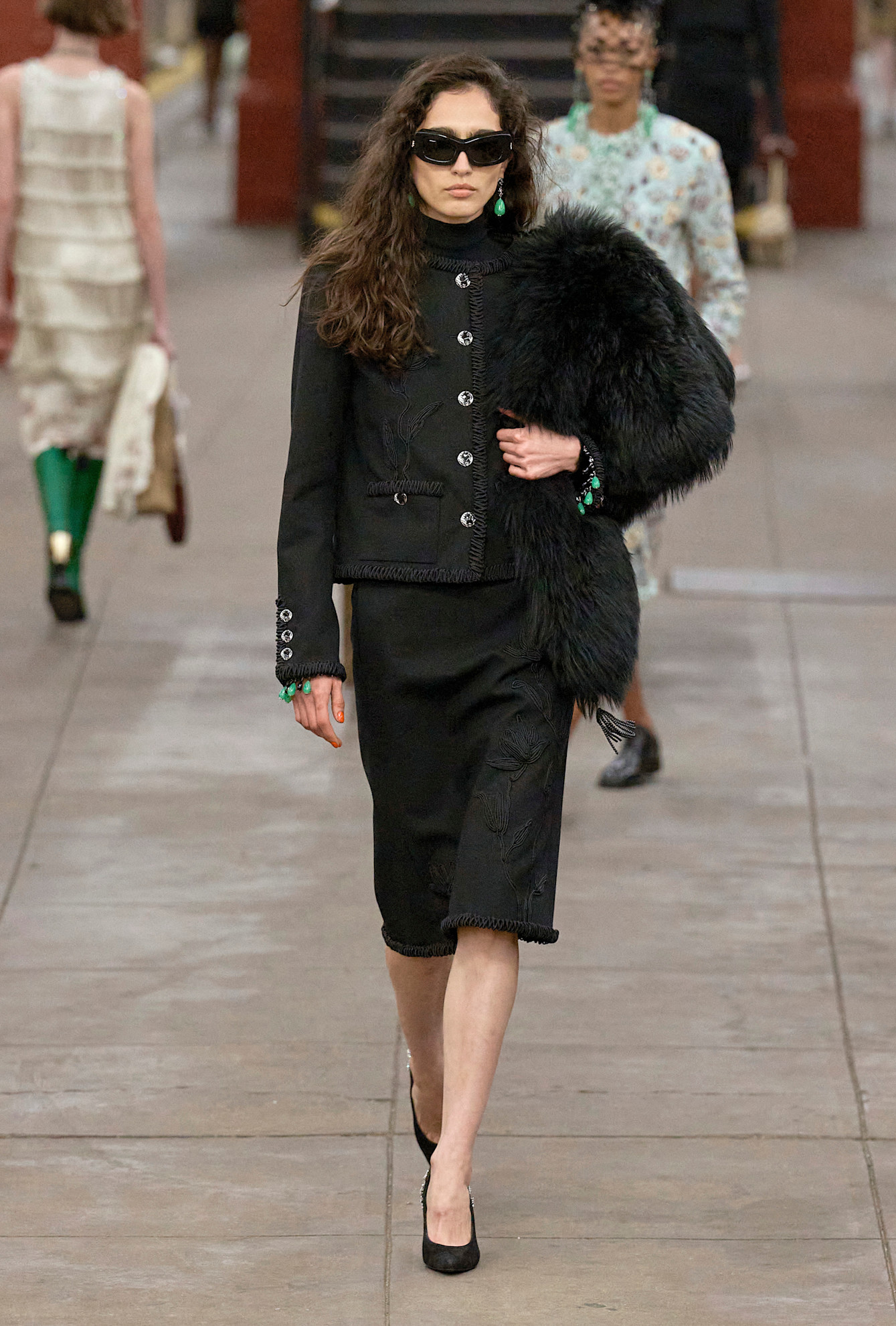 models walk the subway runway for the chanel metiers d'art 2026 show in new york city