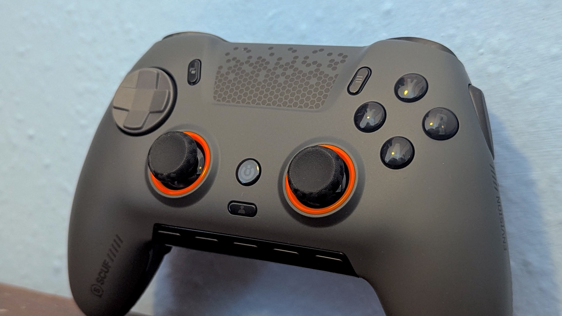 Scuf Envision Pro controller leaning against a wall