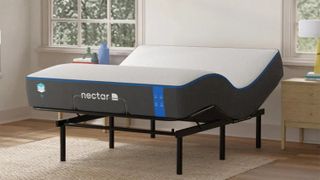 The Nectar The Move Adjustable Bed in a white bedroom and placed on a light wooden floor