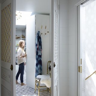 white room with door and carpet floor