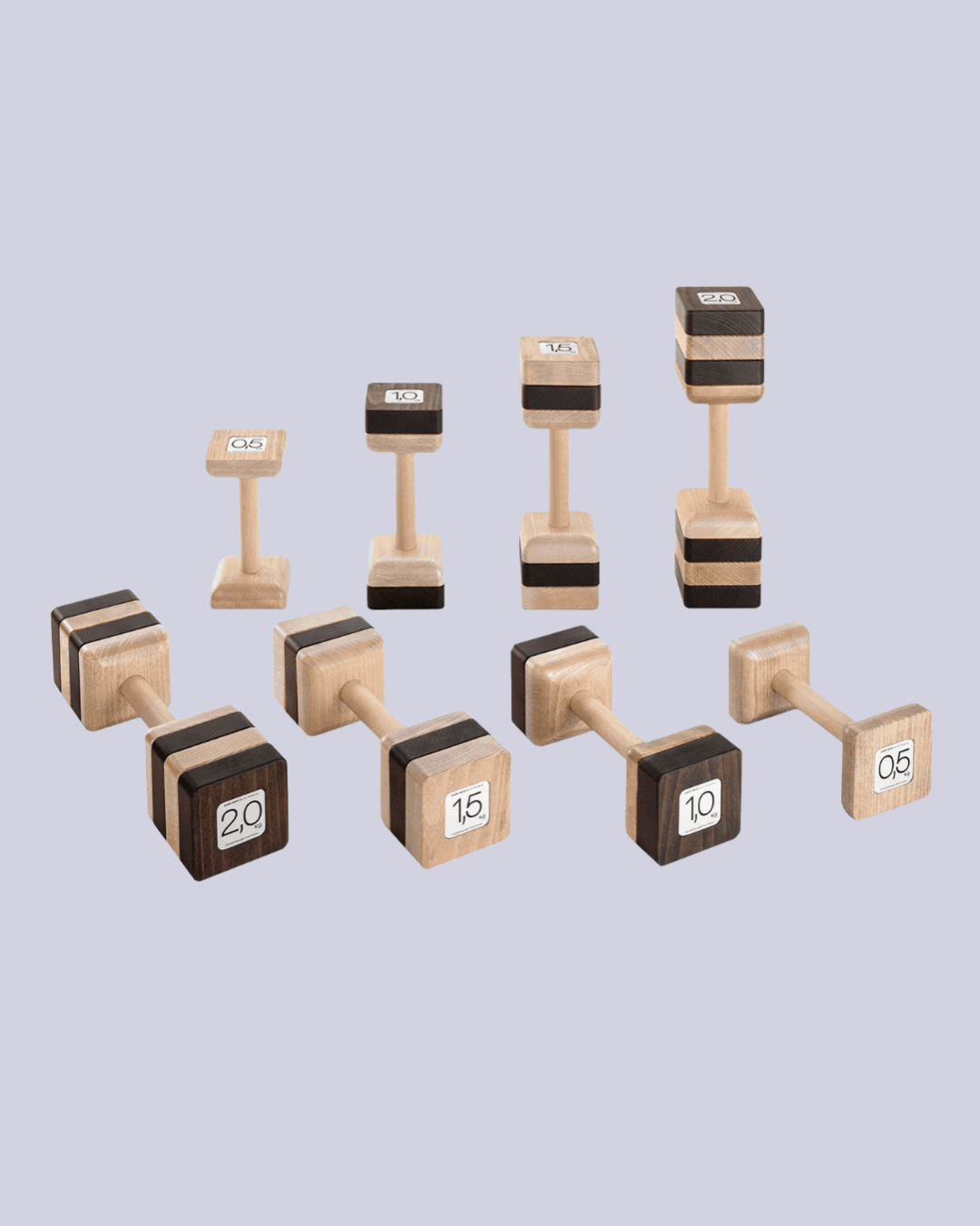 Set of 8 Attico Weights by Basaglia and Rota Nodari in a gif showing it as products against a lilac background and placed in white, wooden shelves in a living room with wooden floors.