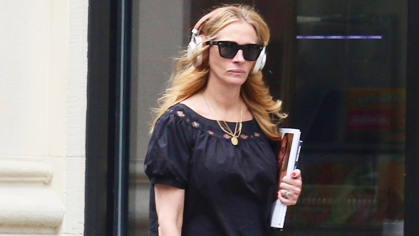 Julia Roberts wearing a black puff-sleeve top with balloon pants and silver Birkenstock Gizeh sandals in NYC