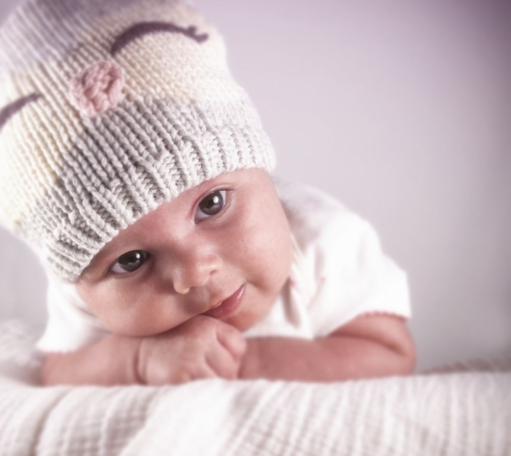 infant girl wearing winter hat.