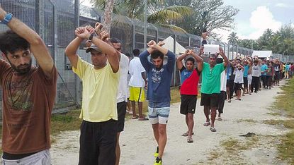 Asylum seekers protest against their forced removal from Manus Island