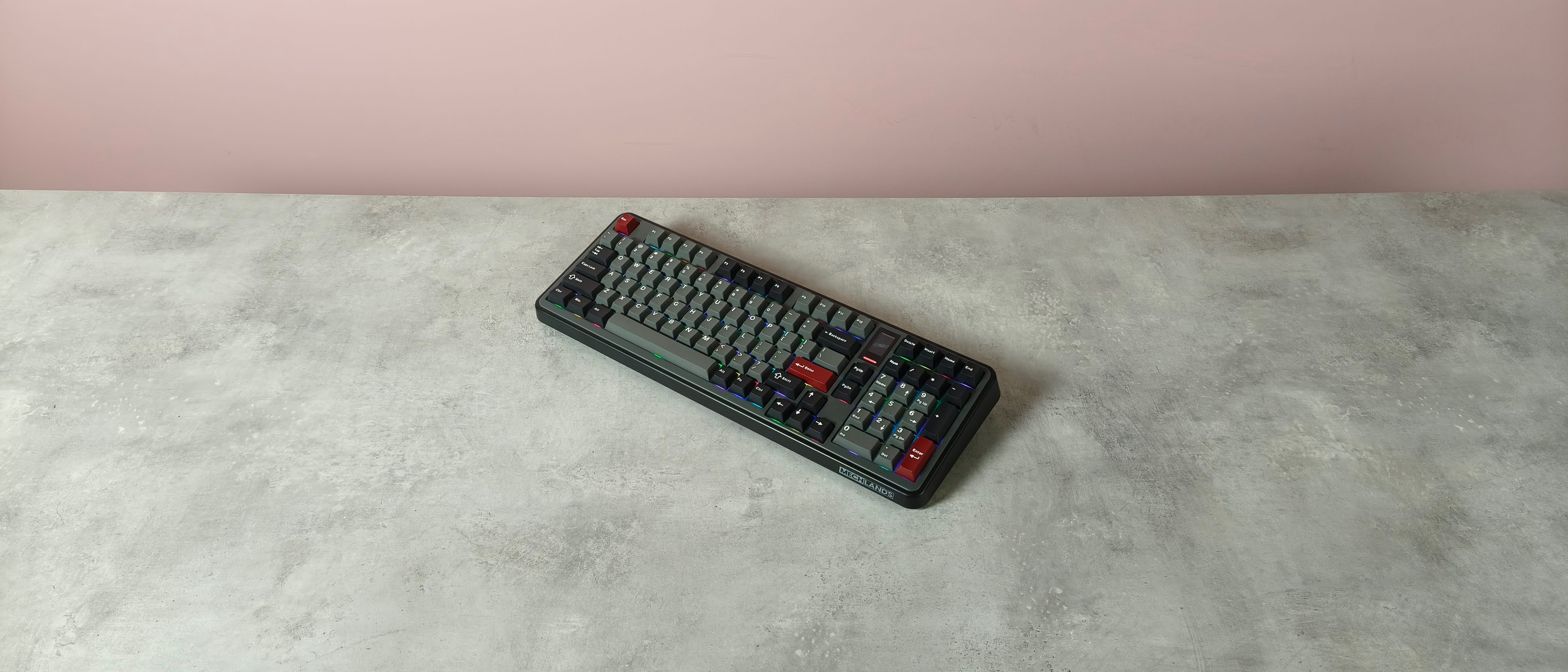 Top-down view of MechLands Vibe99 on table with pink wall in background